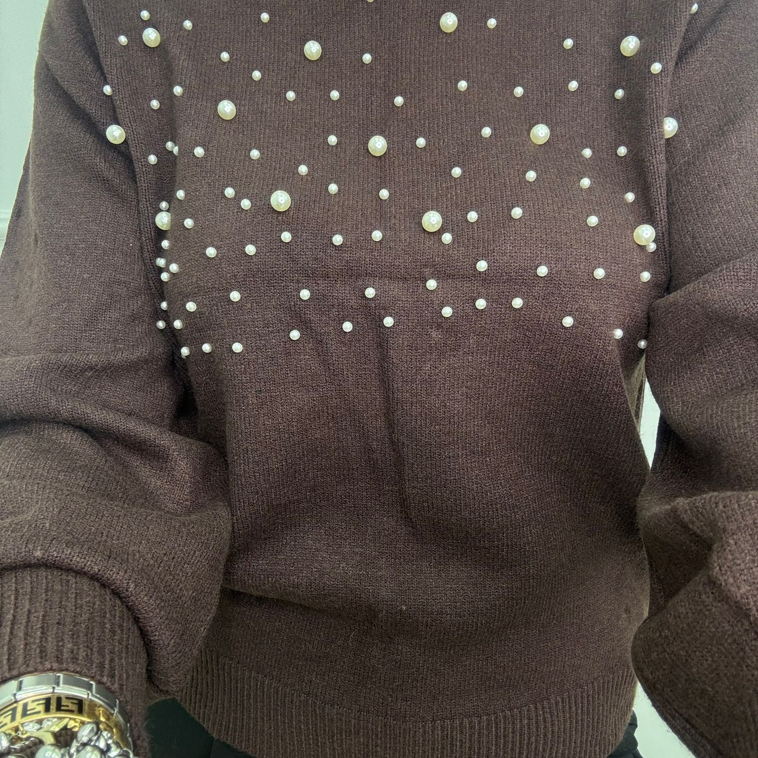 Maglione con perle nella parte superiore