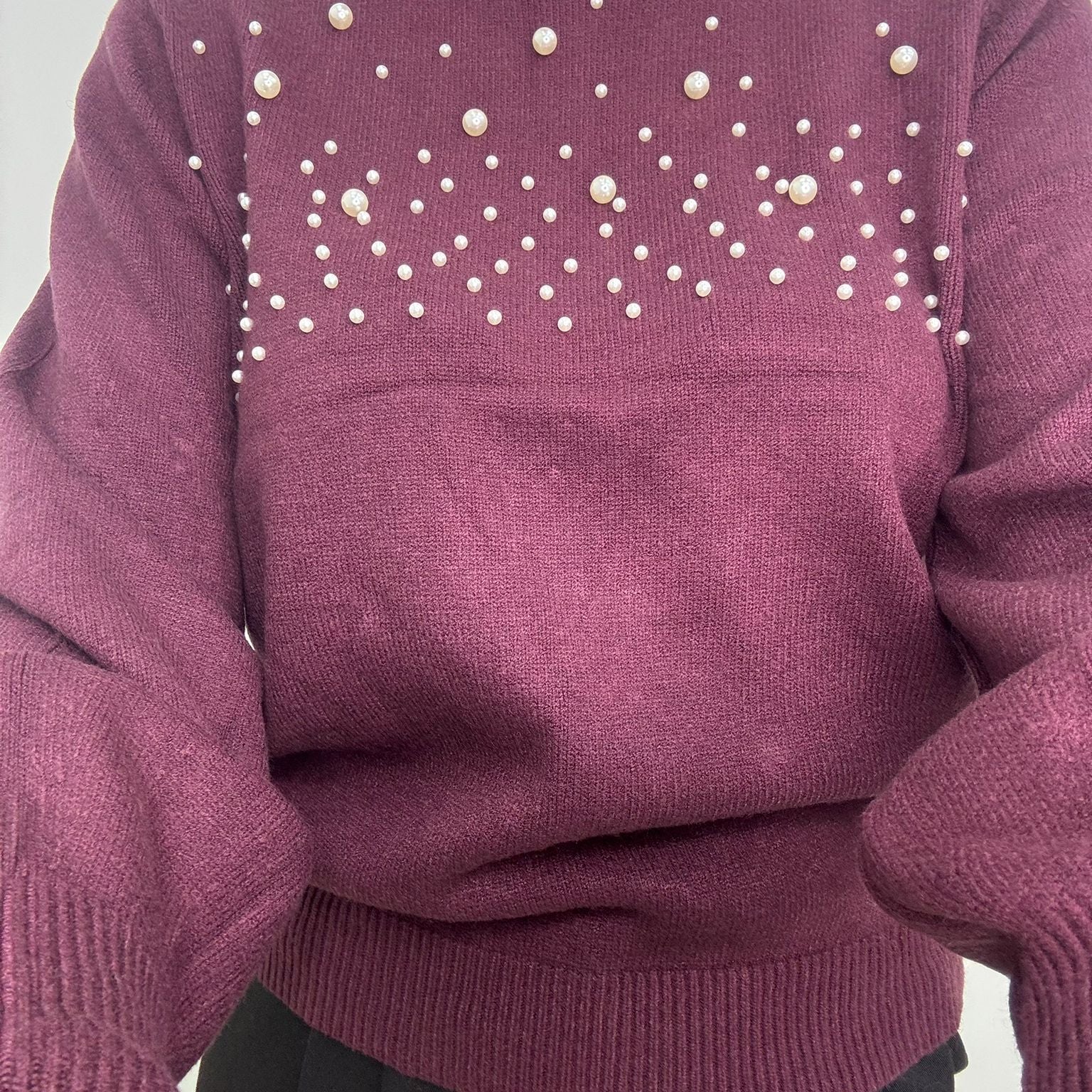 Maglione con perle nella parte superiore