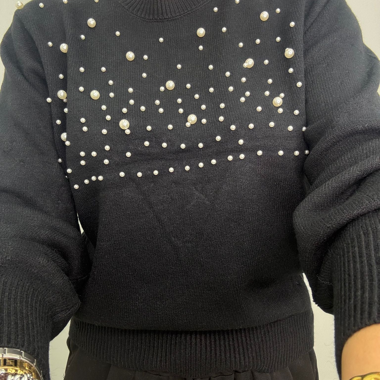 Maglione con perle nella parte superiore