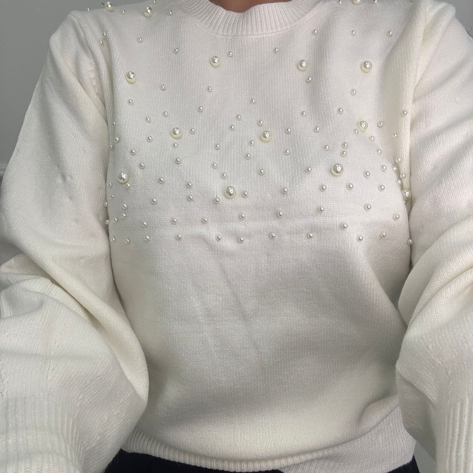 Maglione con perle nella parte superiore