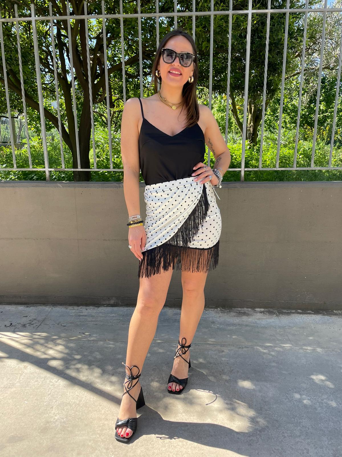 Mini gonna fantasia pois con frange