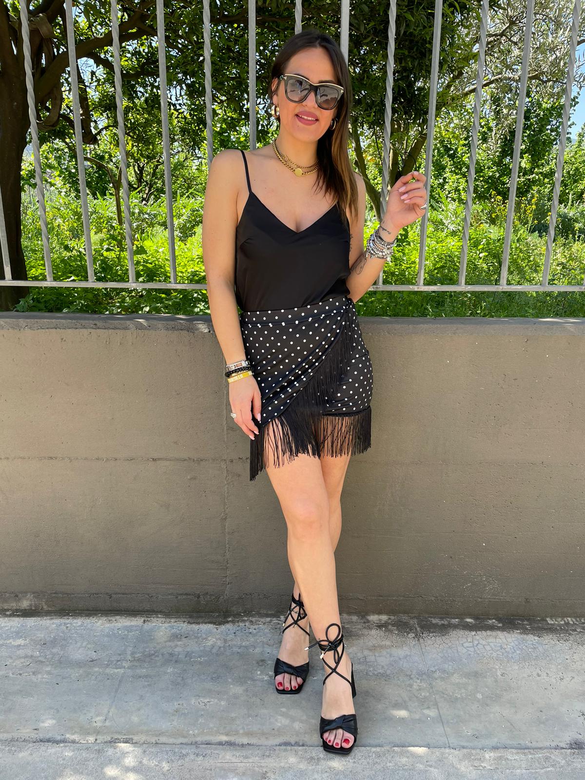 Mini gonna fantasia pois con frange