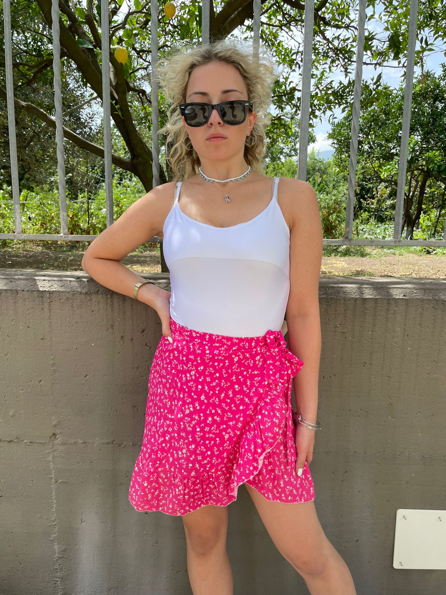 Mini gonna fantasia fiorellini finto portafoglio