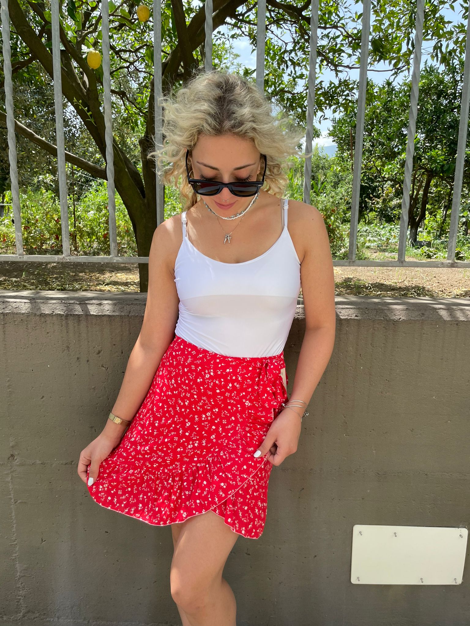 Mini gonna fantasia fiorellini finto portafoglio