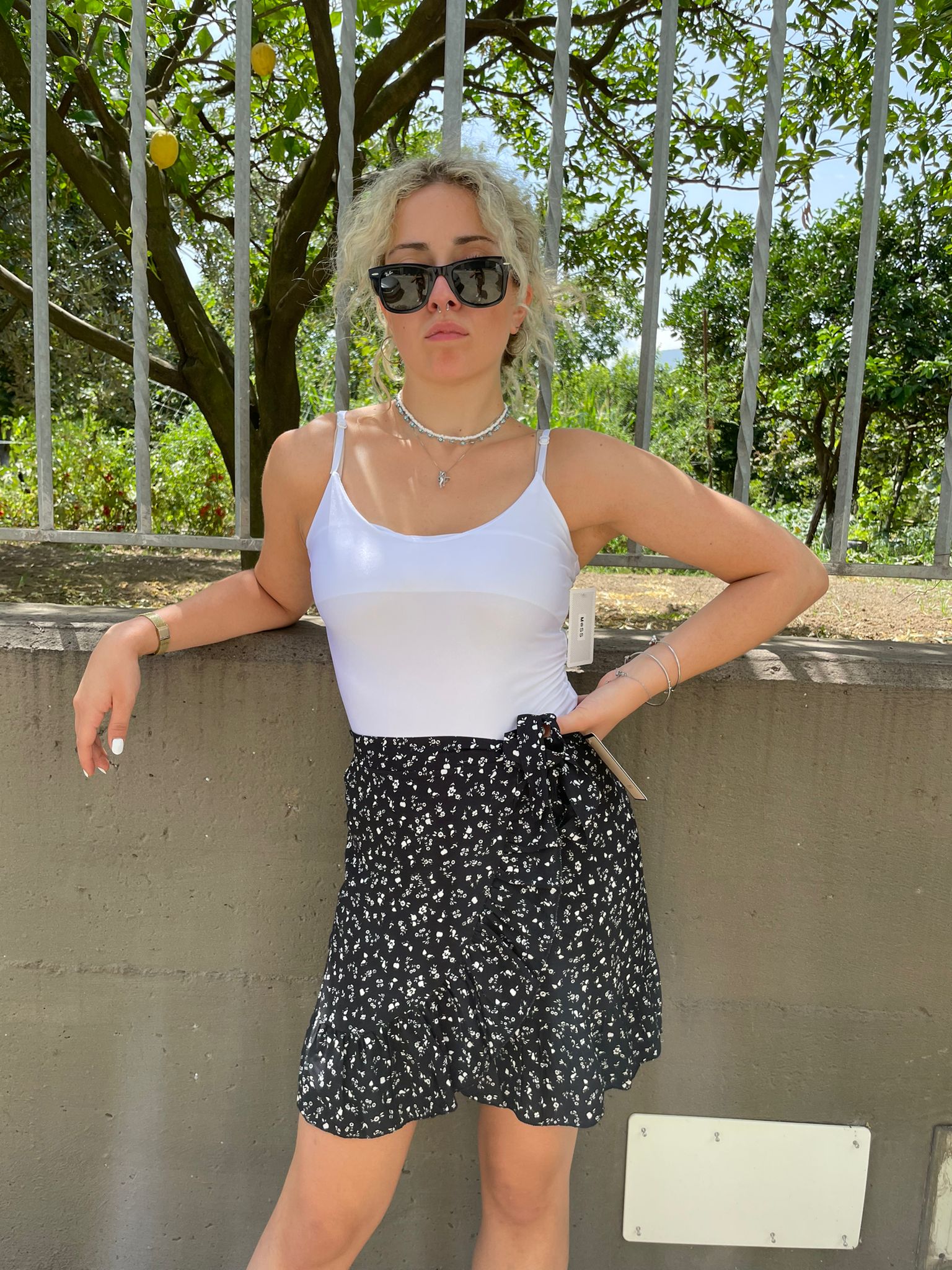 Mini gonna fantasia fiorellini finto portafoglio